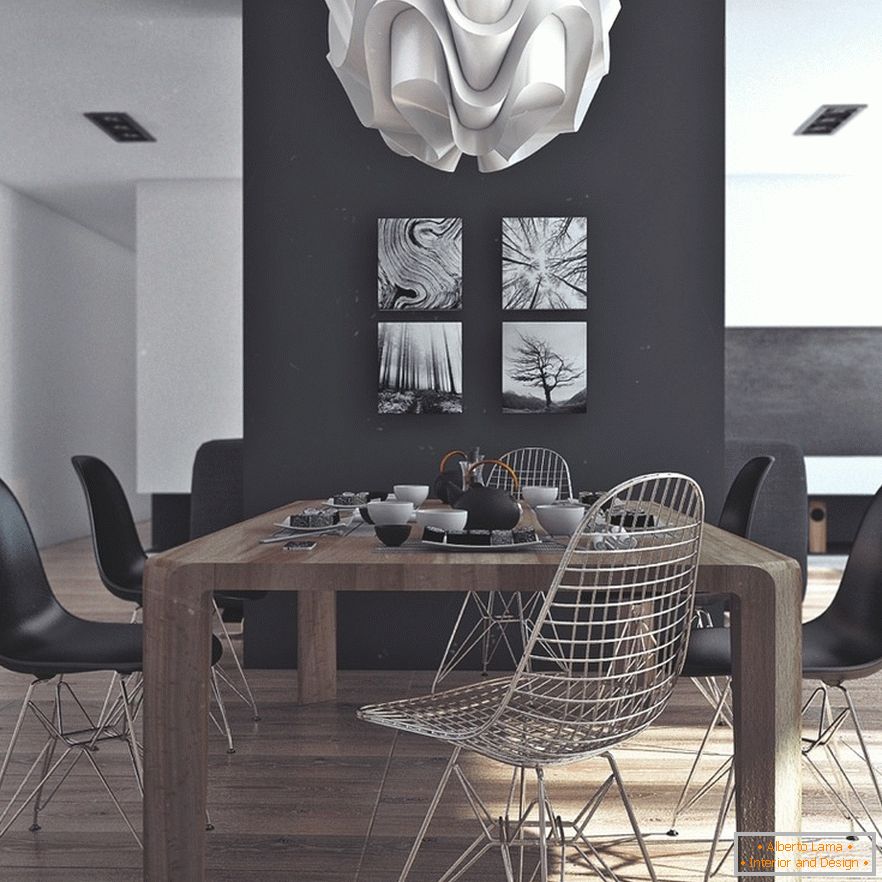 Дървена маса за хранене, черни столове и оригинални картини на черна стена